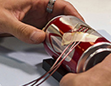 pop can with strain gage attached for testing