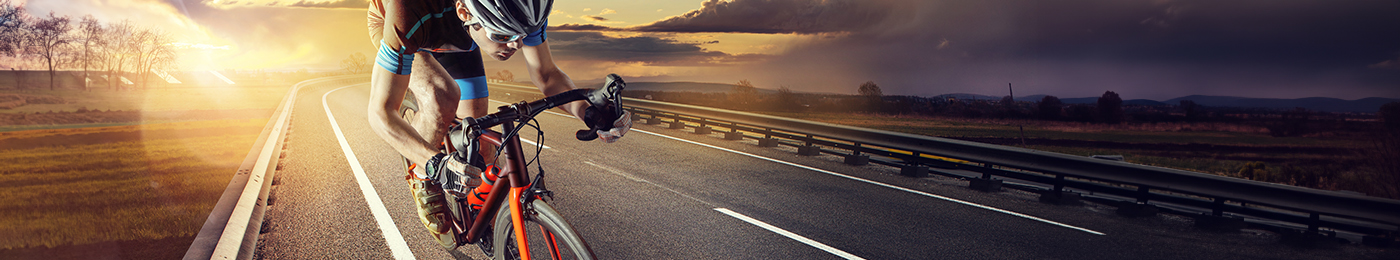 bicyclist peddling on road