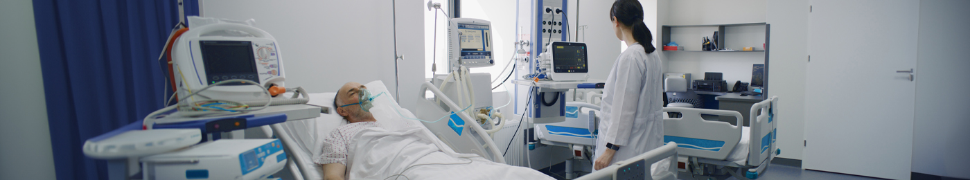 patient and nurse in hospital room