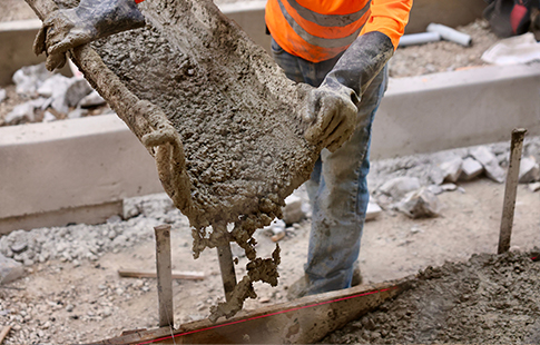 man pouring concrete