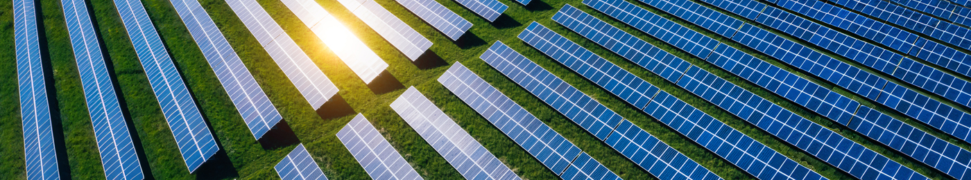 Aerial view over Solar cells energy farm in countryside landscape